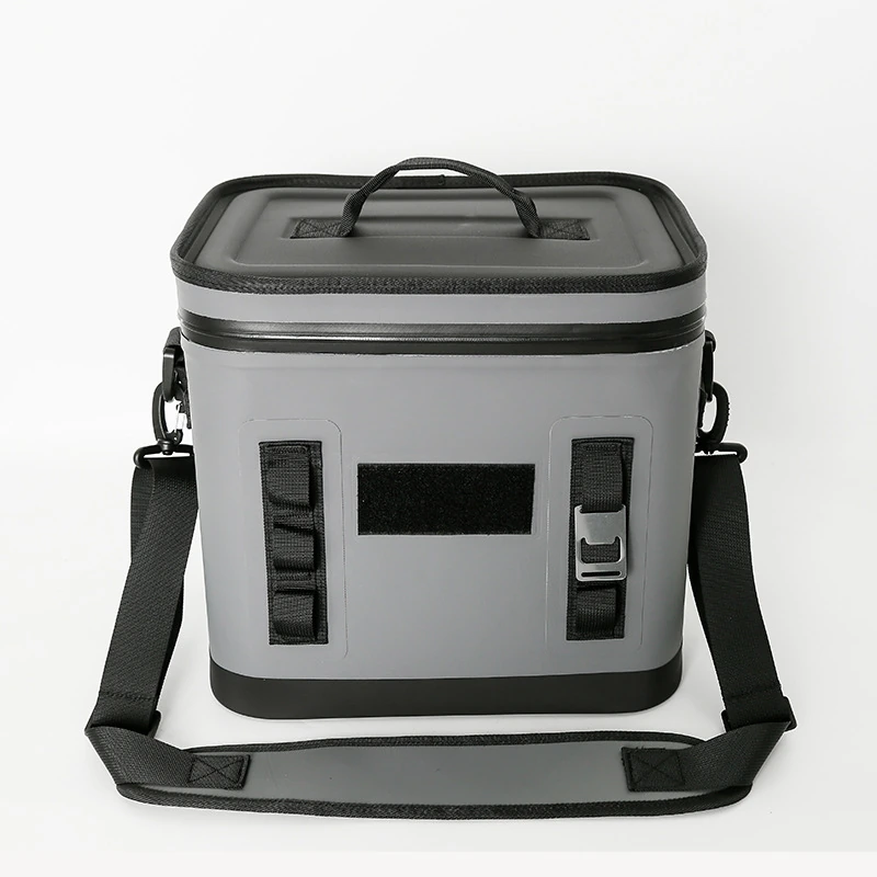 Grey compact waterproof cooler bag with blank front patch panel and padded shoulder strap