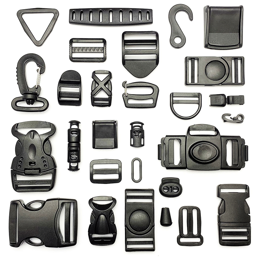 White-background reference collection of black bag buckles, strap adjusters, hooks, rings and cord fittings