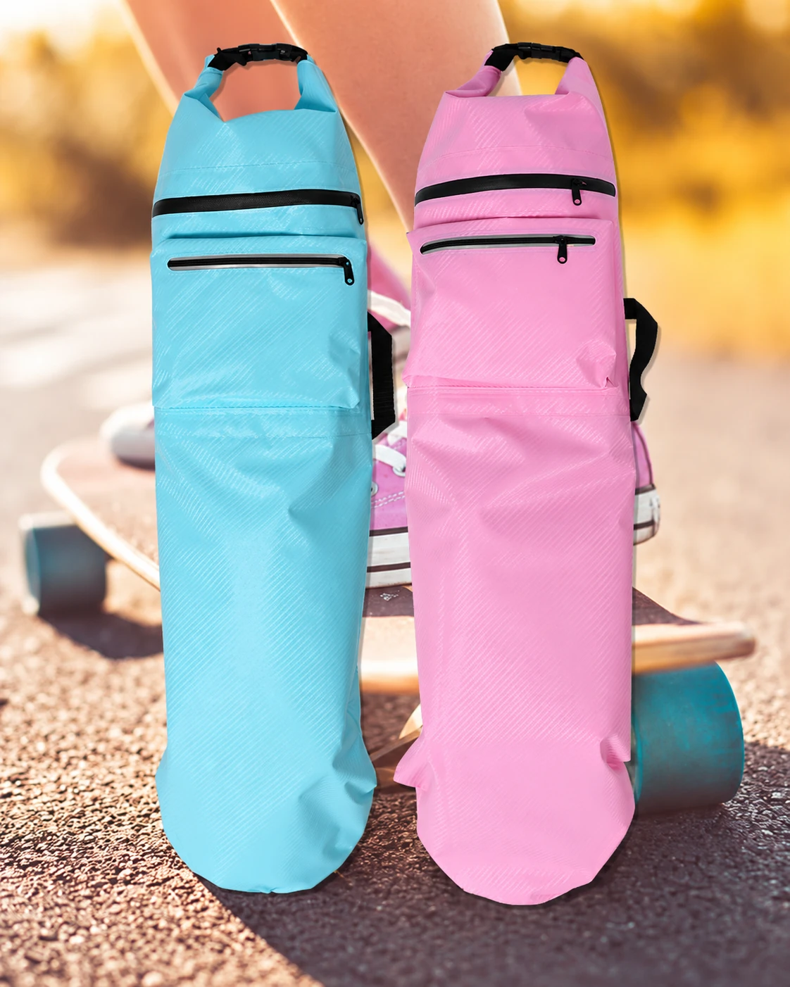 Sky-blue and pink roll-top skateboard backpacks shown full length beside skateboard equipment
