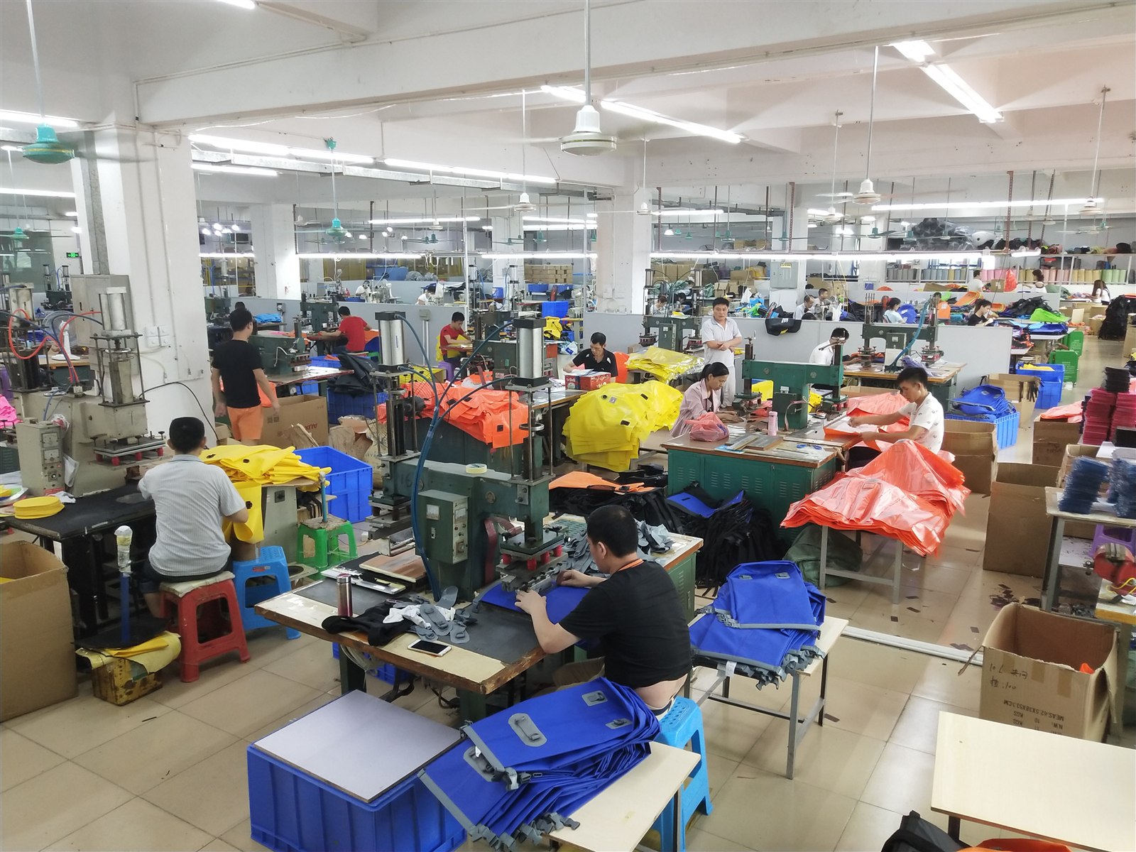 Our Dongguan workshop with staff working on bag production lines